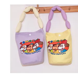 Canvas bucket bag with cute cartoon print and soft padded strap, casual large capacity.