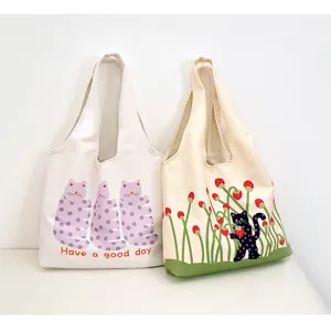 Canvas shoulder bag with cute polka dot cat and strawberry print, large capacity design.