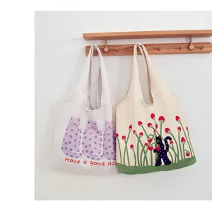 Cute cat print canvas tote bag, detailed view showing cute dotted cats and strawberry patterns.