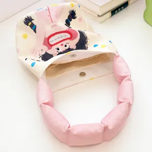 Cute cartoon printed canvas bucket bag with pink padded handle for women casual daily commute.