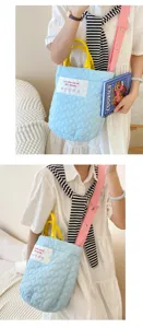 Quilted crossbody bag with heart pattern, yellow handles and pink strap for women.