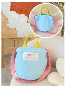 Quilted bucket crossbody bag with yellow handles, pink strap and cute embroidered label detail
