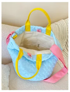 Quilted bucket tote bag for women, cute heart pattern canvas handbag with vibrant straps.