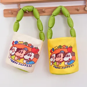 Cute cartoon canvas bucket bag with puffy green handle, casual shoulder handbag for women.