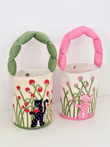 Canvas bucket bag featuring a stuffed handle and cute polka dot cat strawberry print.