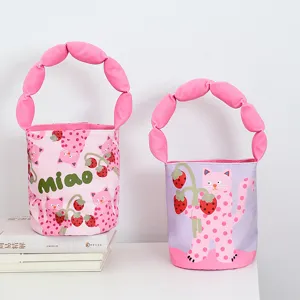 Canvas bucket bag with cute cat strawberry print and soft bubble handles for daily casual use.