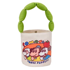 Cute cartoon canvas bucket bag featuring green puffy handle and lovely dog print for kids.