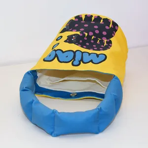 Cute canvas bucket bag with puffy blue handle, cartoon cat print and magnetic closure.