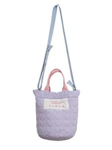 Purple quilted heart crossbody bag with pink handles and shoulder strap for women daily use