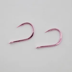 Pink barbed fishing hooks, metal hooks for freshwater carp and grass fishing tackle tools.