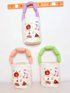 Cute canvas bucket bag with colorful stuffed handles and fun cartoon prints for daily use