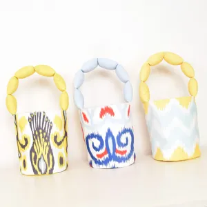 Ethnic printed canvas bucket bag with soft bubble handles for fashionable women daily use.