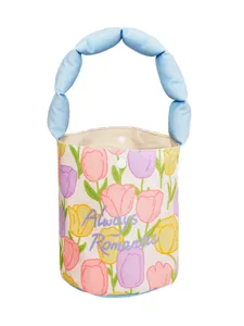 Canvas bucket bag featuring a vibrant tulip print and a stylish blue puffy handle.