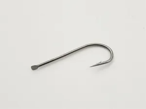 Close-up detail of a sharp barbed fishing hook with long shank for sea angling and fishing.