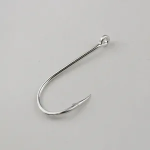 Detailed close-up view of a metal fishing hook with eyelet and barbed point for sea fishing.