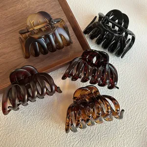 Elegant tortoiseshell and solid color hair claw clips, perfect for stylish updos and daily wear.