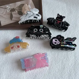 Cute acrylic hair claw clips set with various cartoon designs like ghost, bat, and skeleton.