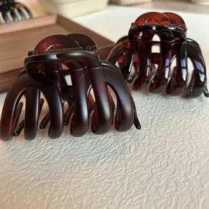 Elegant tortoise shell hair claw clip detail shot, perfect for stylish updo hairstyles and daily use.