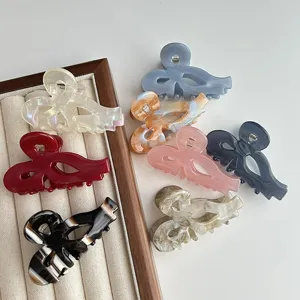 Acetate bow hair claw clip, sweet hollow shark clip for women and girls daily styling.