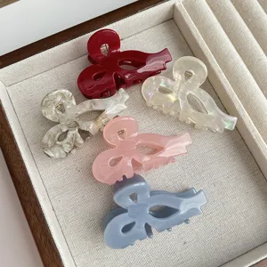 Sweet bow hair claw clips set, elegant acetate hollow shark clips for women and girls daily styling.