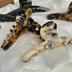 Elegant acetate hair claw clip in tortoiseshell design, large french hair accessory for women.