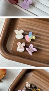 Cute mini acetate hair claw clips with sweet butterfly design, perfect for stylish daily wear.