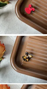 Detailed view of mini acetate hair claw, cute cartoon shape, elegant styling hair accessory.