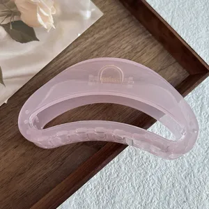 Pink acrylic hair claw clip, translucent geometric half-circle design for women daily styling.