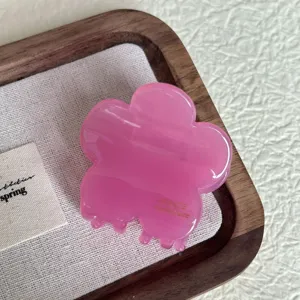 Pink floral hair claw clip, cute medium hair accessory for women and girls daily styling.