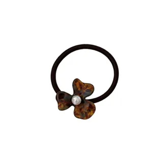 French retro acetate flower hair tie with pearl accent for elegant daily hairstyles.