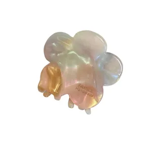 Pearlescent cream flower hair claw clip for women, elegant daily hair styling accessory.