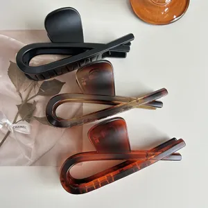 Large hair claw clip set, retro tortoiseshell and solid black styling for thick hair.