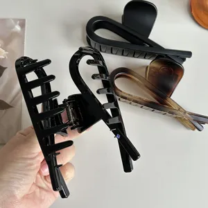 Large hair claw clip set, elegant tortoiseshell and black matte shark clips for thick hair.