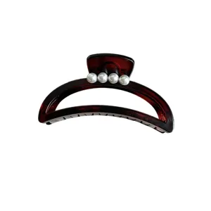 Elegant crescent hair claw clip with white pearls, chic French style hair accessory for women.