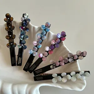Chic acetate flower hair clips set, elegant floral duckbill side clips for daily styling.