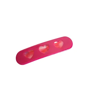 Pink acetate hair clip with cute hollow hearts, sweet side clip for bangs and styling.
