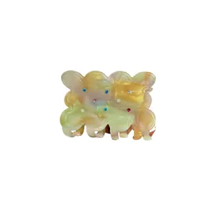 Bicolor rhinestone acetate hair claw clip with cute wavy design for stylish women daily.