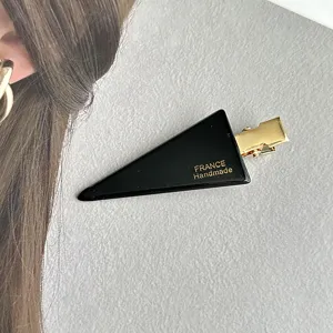 Fashion black triangle hair clip, elegant side hairpin and bangs clip for women's stylish look.