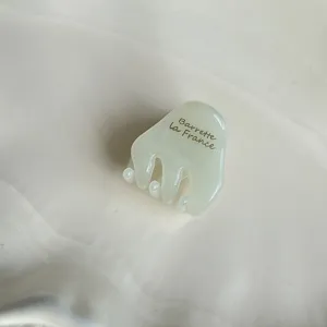 Cute mini acetate hair claw clip for women, vintage small side hair accessory for bangs.