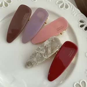 Acetate hair clips set featuring chic triangle shape and assorted colors for daily sweet styling.
