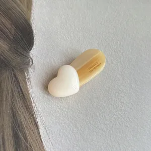 Detailed view of the cute white heart hair clip with elegant handmade finish and design.