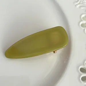 Green acetate hair clip detail shot, elegant French style duckbill clip for daily styling.