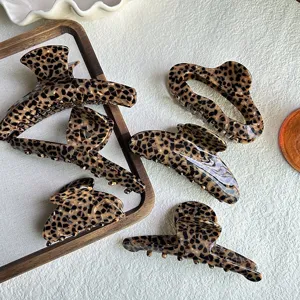 Leopard print hair claw clips, stylish acetate shark clips for women hair styling and buns.