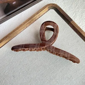 Brown plaid velvet hair claw clip detail, elegant retro style hair accessory for women buns.