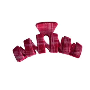 Red plaid velvet hair claw clip for women, stylish winter hair accessories for elegant hairstyles.