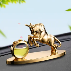 Golden bull car perfume diffuser ornament, luxury auto interior decoration bottle.