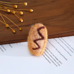 Wool felt handmade DIY craft accessory oval shaped patch for hat decoration and hair clips.