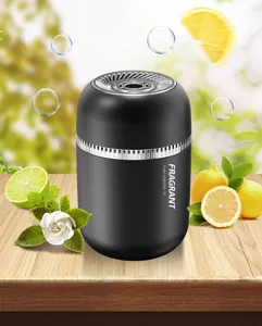 Solid car air freshener detail shot, modern black cylindrical design with aromatic plant scent.