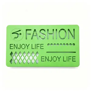 Green plastic car aromatherapy cover plate with hollow fashion design and smooth texture.