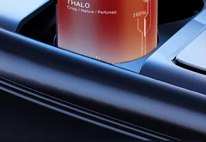 Car solid air freshener in cup holder, red tin container, long-lasting scent, detail view.